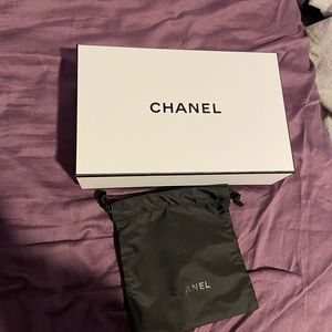 Chanel box with mini black makeup bag